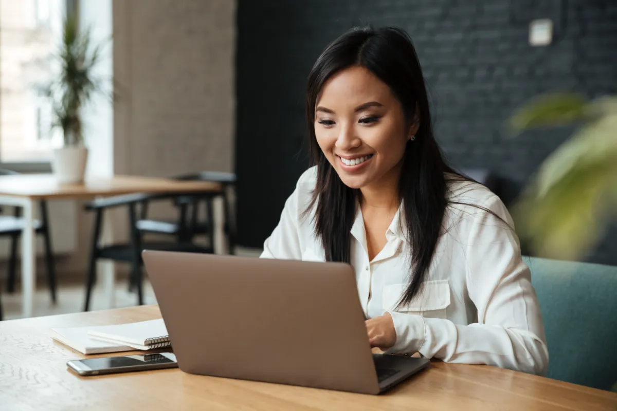 happy woman on computer