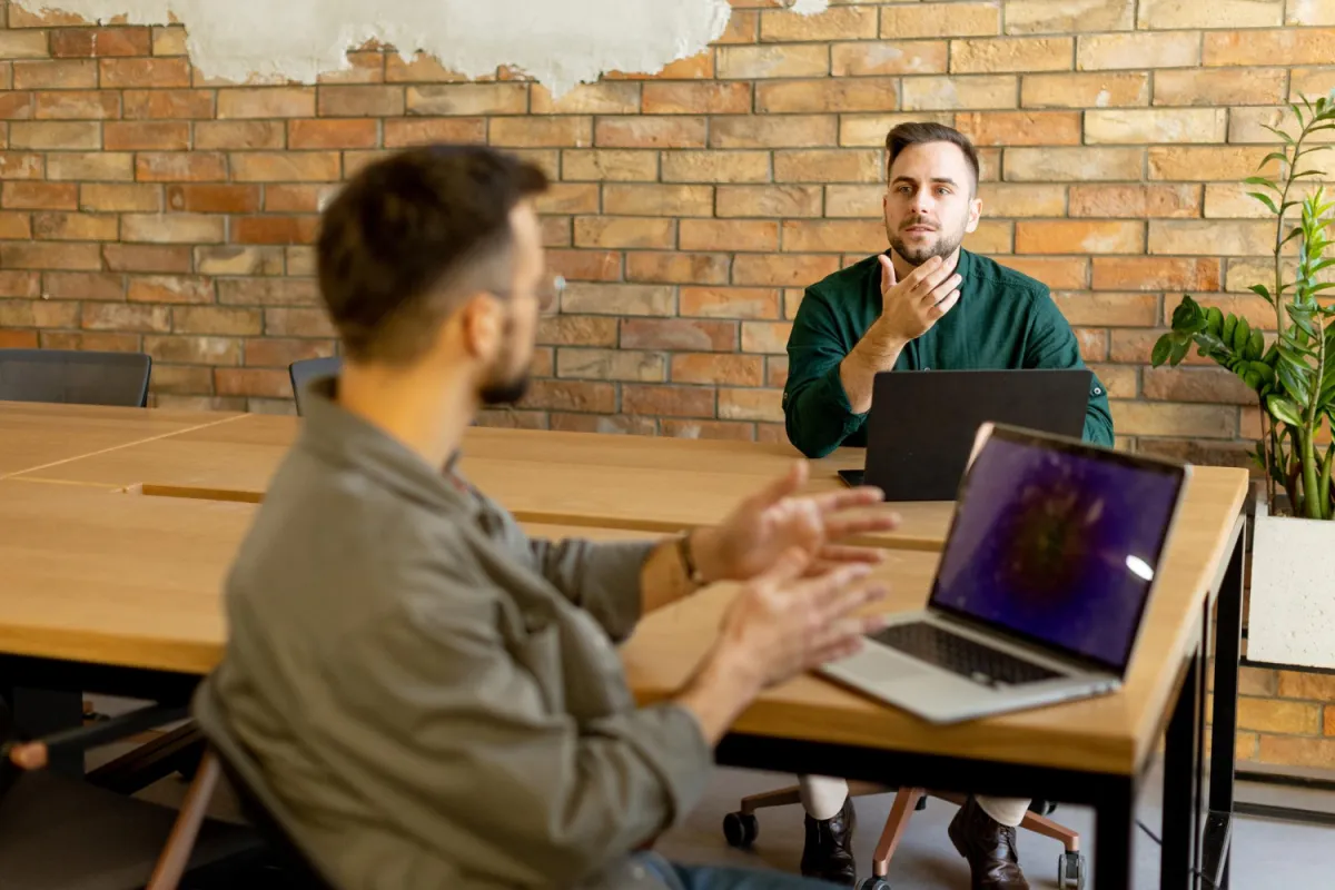 hiring managers discussing their hiring process for a remote developer